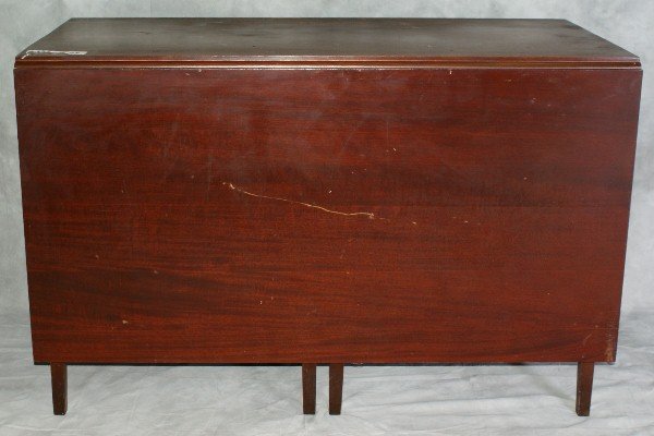 Mahogany drop leaf dining table circa 1920: Mahogany drop leaf dining table circa 1920. H:30" Length closed:24.25" Length opened:72.75" W:47"