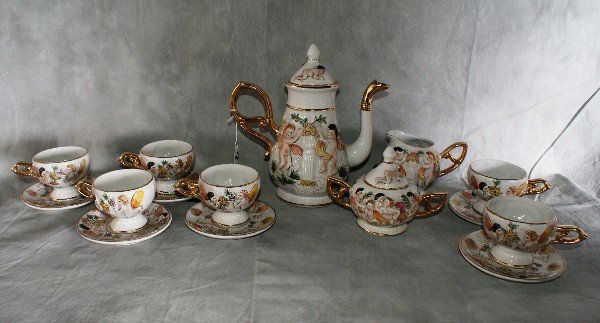 15 piece Capodimonte porcelain teaset. Teapot H:10.: 15 piece Capodimonte porcelain teaset. Teapot H:10. 25".