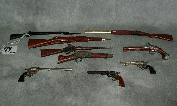 9 piece set of miniature guns.: 9 piece set of miniature guns.