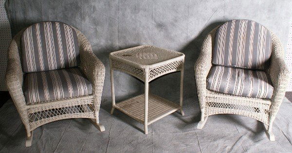 2 wicker rocking chairs and 1 wicker table.: 2 wicker rocking chairs and 1 wicker table.