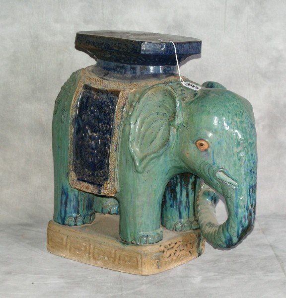 Painted terracotta elephant plant stand.: Painted terracotta elephant plant stand. H:21" L:22" D:10"