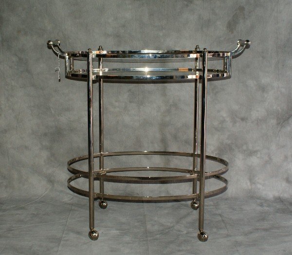 Chrome and glass top tea cart: Chrome and glass top tea cart. H:34" L:35" D:20"