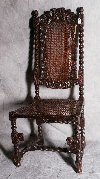19th C oak and cain carved high back chair. H:48" W: 19th C oak and cain carved high back chair. H:48" W:22" D:18"