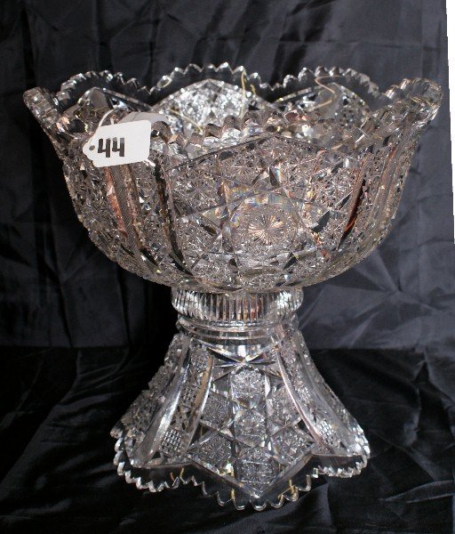 Heavily cut crystal punch bowl on base. H:11.5" D:1: Heavily cut crystal punch bowl on base. H:11.5" D:12"