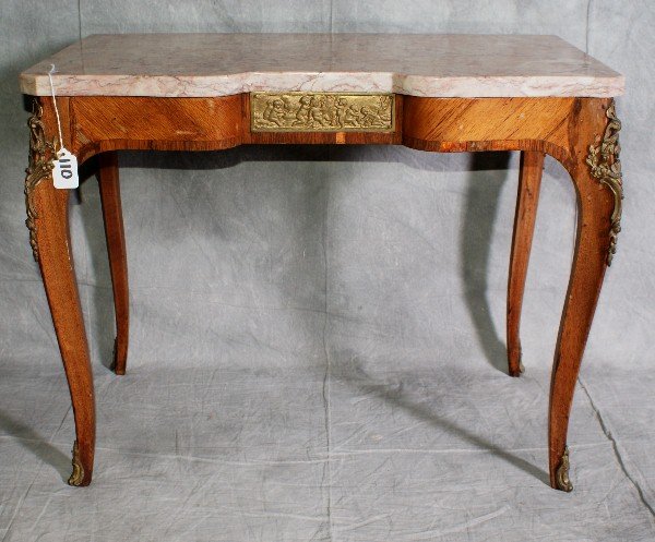 19th C French marble top table with bronze mounts : 19th C French marble top table with bronze mounts on legs and a bronze plaque on front of playing puttis. H:20" L:25.5" D:15"