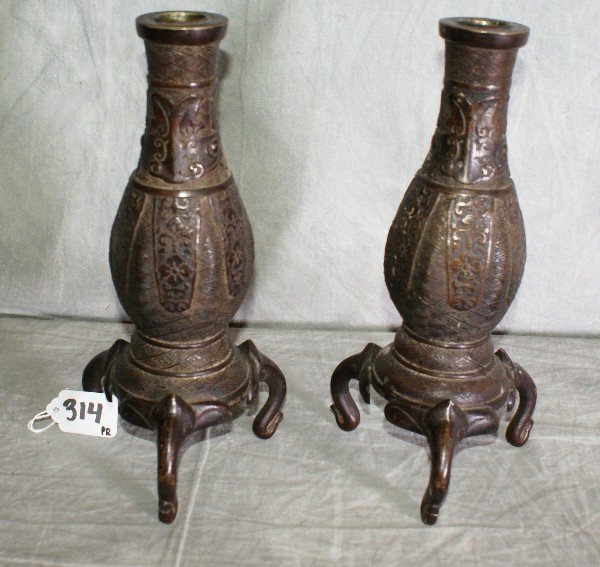 Pair Japanes bronze candlesticks raised on elephan: Pair Japanese bronze candlesticks raised on elephant trunks. H:10.5"