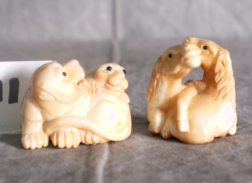 Two marine ivory animal netsukes.: Two marine ivory animal netsukes.