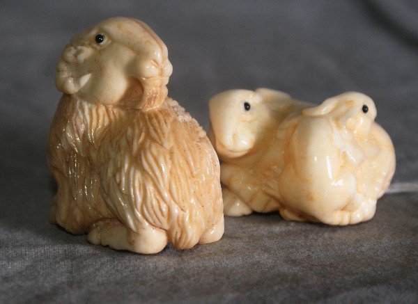 Two marine ivory animal netsukes.: Two marine ivory animal netsukes.