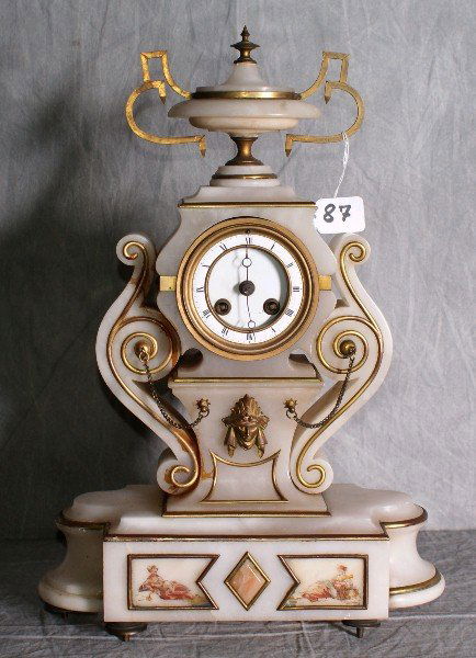 19th C Bronze and alabaster mantle clock. H:18" W: 19th C Bronze and alabaster mantle clock. H:18" W:12".