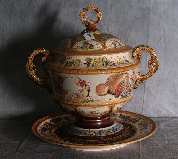 Large Mettlach covered 2 handled tureen on servin: Large Mettlach covered 2 handled tureen on serving plate. H:11" D:16".