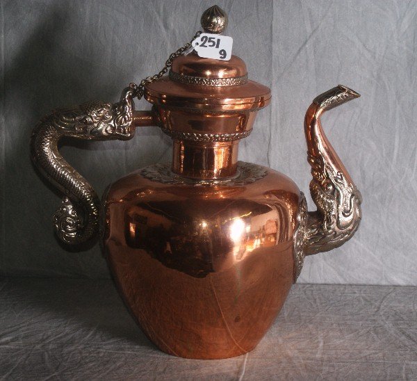 Antique Tibetan copper and silver very large teapot pur: Antique Tibetan copper and silver very large teapot purchased in 1953 from an antique shop in Tibet, we have pictures of consignor buying this item from the lady at the shop. H:16" L:15".