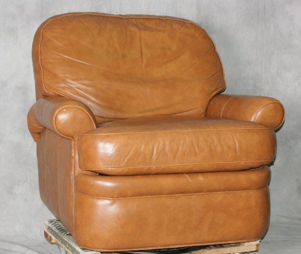 Leather reclining rocking chair. H:34" W:36" D:38": Leather reclining rocking chair. H:34" W:36" D:38"
