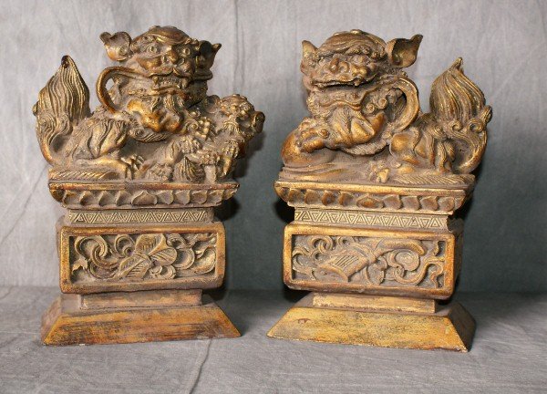 Chinese 19th C pair carved wood foo dogs: Chinese 19th C pair carved wood foo dogs with original gilding. H:9" L:7" D:4.5"