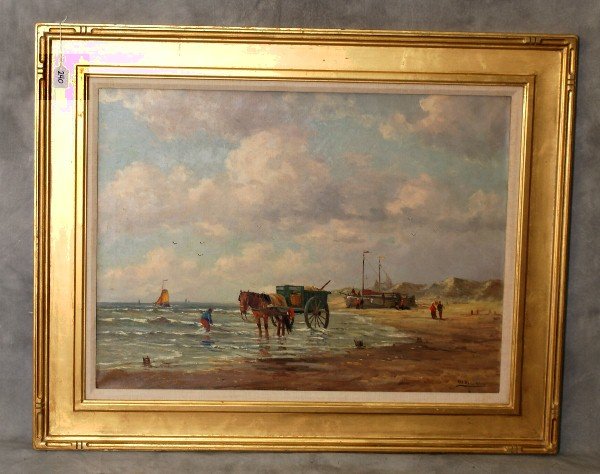 PIETER JOHANNES A. WAGEMANS (Dutch. 1879-1955): "Low Tide with Boats, Horse Cart and Clam Diggers". Signed l/r. Oil on Canvas in a Gilded and carved frame. overall size H:32.5" W:40.5"