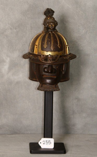 Edo period Japanese bronze & iron Mempo mask & helmet: Edo period Japanese bronze and iron mixed metal Mempo mask and helmet with gold spotted foo dog top on a later iron stand. figure size H:9" overall size H:16.5"