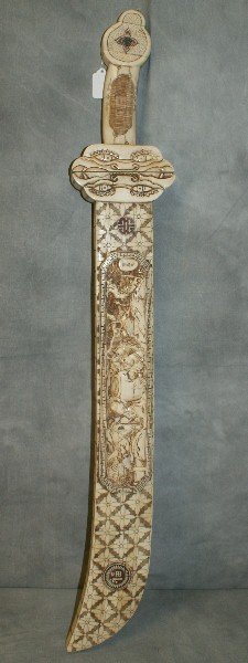 Large Chinese marine ivory carved sword with marine ivo: Large Chinese marine ivory carved sword with marine ivory blade. L:38"