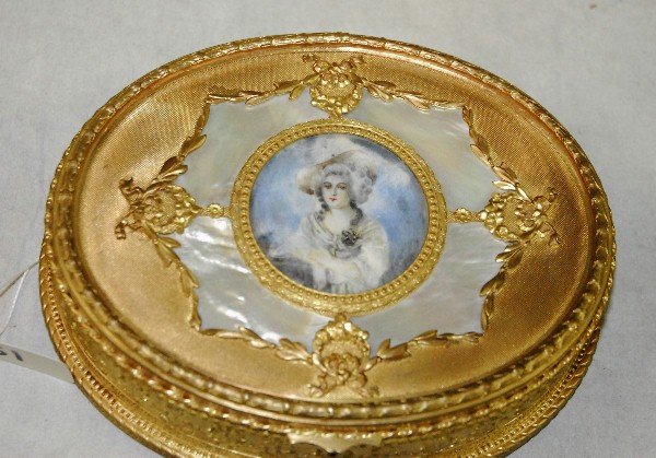 19th C Dore bronze and mother of pearl hige covered box: 19th C Dore bronze and mother of pearl hige covered box with painting if woman in center, marked on bottom France and also Ovington New York. H:2.25" L:7.25" D:6"