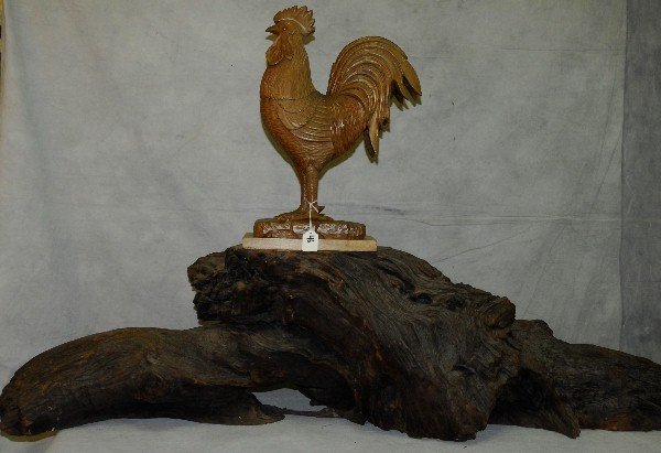 carved wood rooster on driftwood base , Rooster signed: carved wood rooster on driftwood base , Rooster signed J. Pinal. Overall size H:31" L:48" Rooster size H:18"