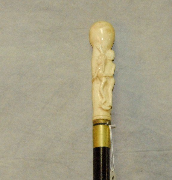 Marine ivory figural walking stick. L:39. 5": Marine ivory figural walking stick. L:39. 5"