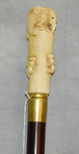 Marine ivory figural walking stick with hair line: Marine ivory figural walking stick with hair line crack. L:36"