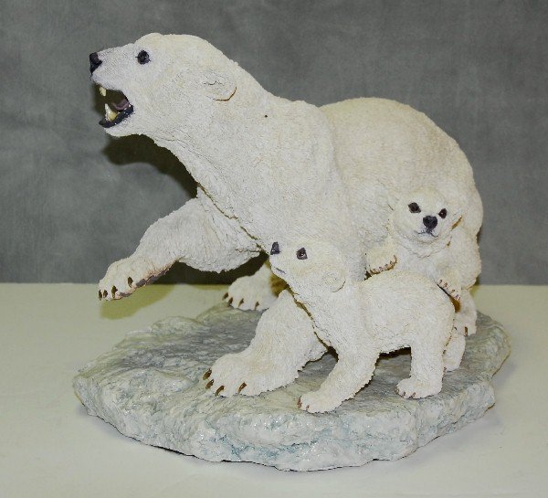 Ceramic sculpture of polar bear protecting her cubs by: Ceramic sculpture of polar bear protecting her cubs by Johanna Drummond. H:13" L:15.5"