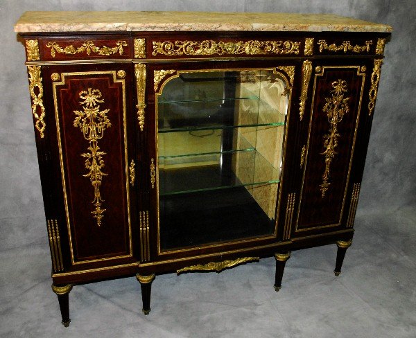 Henry Dasson signed bronze-mounted marble top cabinet,: Louis XVI style bronze-mounted marble top cabinet, signed: Henry Dasson 1872 havingvery fine cast bronze mounts with a single glass door flanked by 2 bronze mounted wooddoors H:47" W:53" D:17" . This