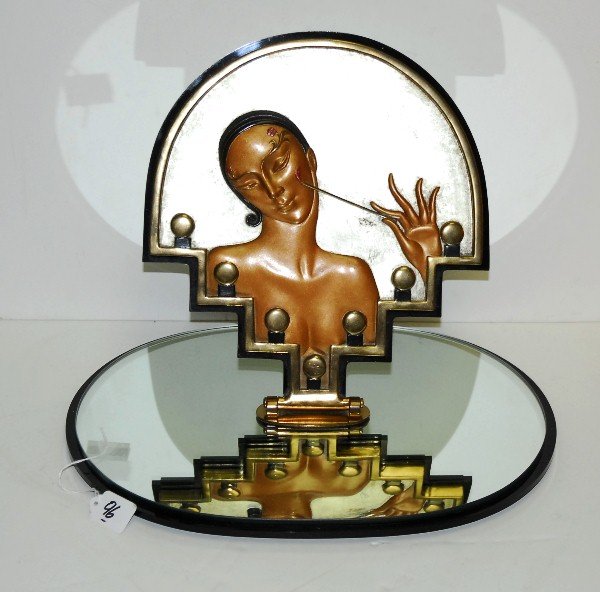 Signed Erte bronze plaque on mirrored stand titled "van: Signed Erte bronze plaque on mirrored stand titled "vanity" H:12.75" W:17.25" signed and numbered 145/250.