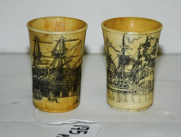 2 scrimshaw cups with harbor scenes and Boston: 2 scrimshaw cups with harbor scenes and Boston Massachusetts on back on one. H:2.5"
