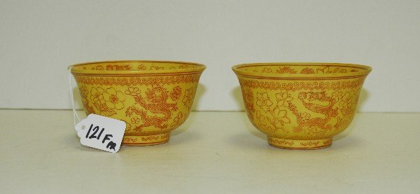 Pair antique Chinese yellow and iron red dragon bowls: Pair antique Chinese yellow and iron red dragon bowls with red seal marks on bottom. H:3"D:5.25"