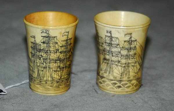 Pair scrimshaw cups. H:2. 5".: Pair scrimshaw cups. H:2. 5".