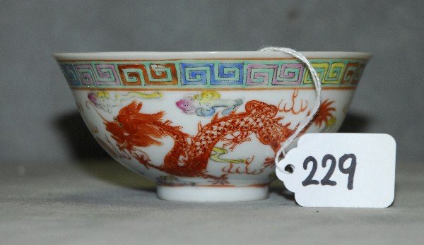 Antique chinese famille rose porcelain dragon bowl with: Antique chinese famille rose porcelain dragon bowl with 6 character mark on bottom. H:2.25" D:5"