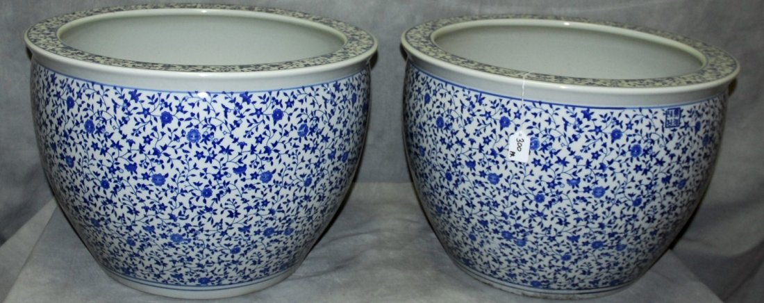 Pair Chinese blue and white porcelain fish bowls.: Pair Chinese blue and white porcelain fish bowls. H:14.5" D:21"