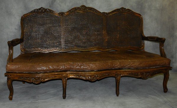 19th C Mahogany country french cane settee. H:43" W:77": 19th C Mahogany country french cane settee. H:43" W:77" D:32"