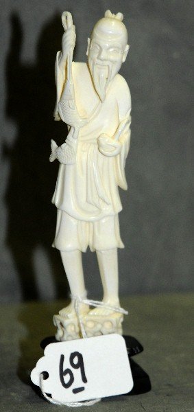 Chinese ivory figure of fisherman holdinghis catch.: Chinese ivory figure of fisherman holdinghis catch. H:6.75"