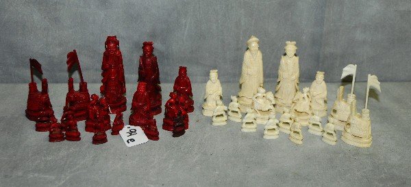 Chinese carved ivory chess set with natural and: Chinese carved ivory chess set with natural and teastain pieces. Largest piece H:4"