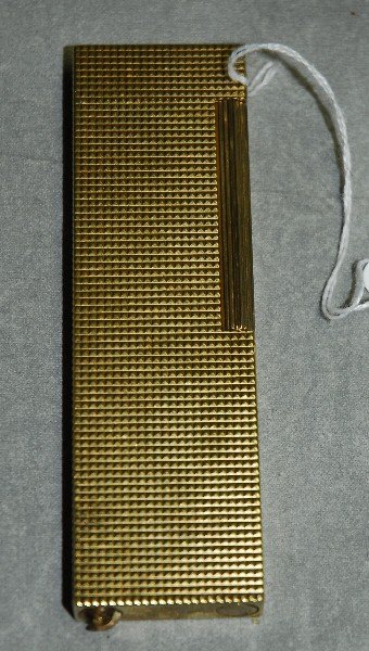 ST Dupont Gold Tone Butane Lighter. Identification: ST Dupont Gold Tone Butane Lighter. Identification number 84bnn54 . Signed ST Dupont