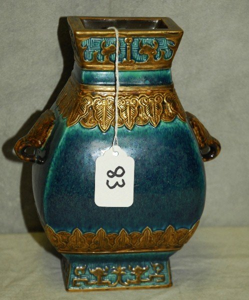 Antique Chinese blue/green glazed porcelain vase with: Antique Chinese blue/green glazed porcelain vase with gold and brown highlights and animal handles, chop mark on bottom. H:8.25" W:7" D:4"