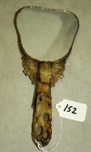 Chinese silver and jade mirror with the handle being: Chinese silver and jade mirror with the handle being made of a antique jade belt buckle. Overall L:8.5" belt buckle L:4.75"