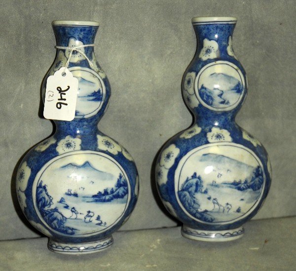 Pair Chinese blue and white porcelain wall pockets with: Pair Chinese blue and white porcelain wall pockets with 6 character marks on bottom.H:7.75" W:4.25"