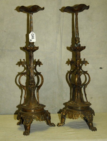 Pair bronze pricket sticks raised on lion paw feet.: Pair bronze pricket sticks raised on lion paw feet. H:20.75"