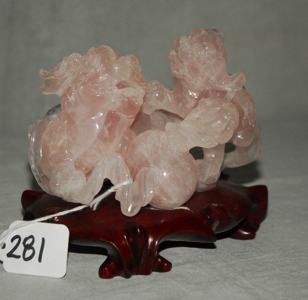 Chinese rose quartz figural group of foodogs on wood: Chinese rose quartz figural group of foodogs on wood base. H:4.75" L:5.5"