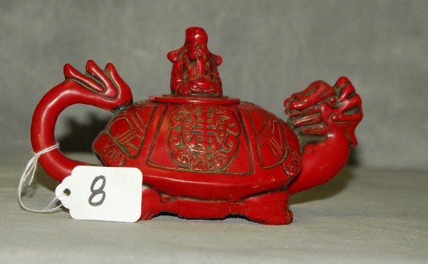 Chinese coral colored dragon form teapot with chop mark: Chinese coral colored dragon form teapot with chop mark on bottom. H:4.5" D:7"