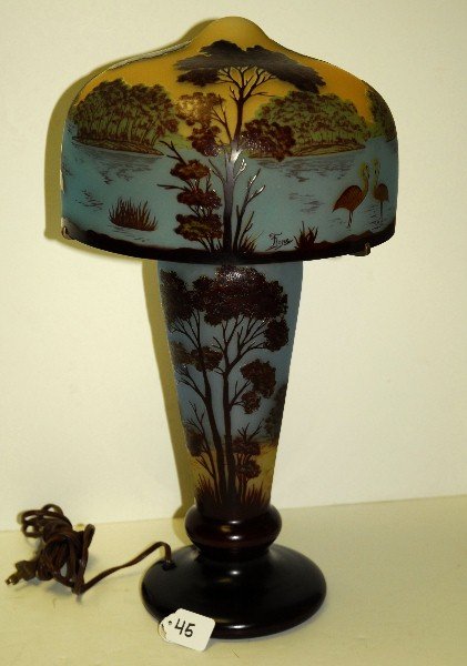 Very nice Signed cameo art glass lamp with flamingos in: Very nice Signed cameo art glass lamp with flamingos in water landscape scene in relief. H:20" D:10.5"