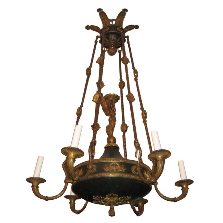 Empire gilt and patinated bronze six-light chandelier,: Empire gilt and patinated bronze six-light chandelier, each candle arm in the form of a swan and centering a winged caryatid holding a basket, anthemion corona issuing rope-form and medallion chains. 