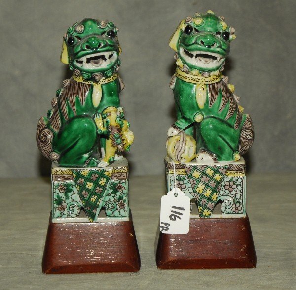 Pair of Chinese porcelain Foo Dogs on wood stands, red: Pair of Chinese porcelain Foo Dogs on wood stands, red stamp China on bottom 9 5"