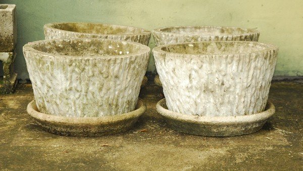 Four cast stone planters and under plates H: 12" D: 19: Four cast stone planters and under plates H: 12" D: 19 25"