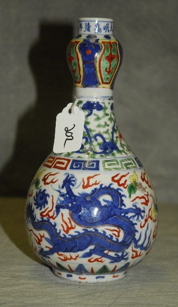 Antique Chinese Wucai porcelain dragon vase with: Antique Chinese Wucai porcelain dragon vase with six character mark on rim. 9"