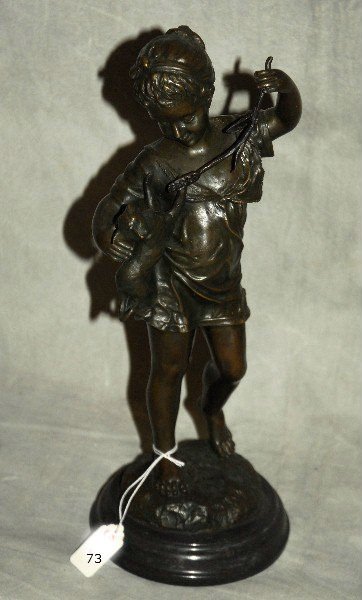 Bronze statue of a girl with her kitten, signed.: Bronze statue of a girl with her kitten, signed. H:15.25".