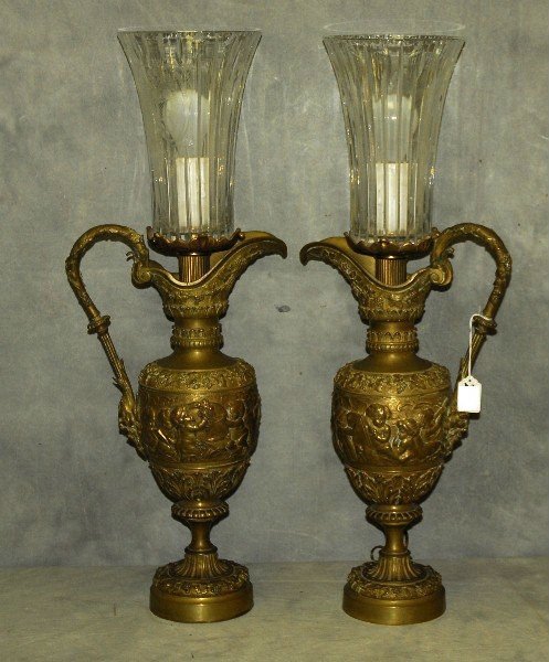 28. 19th C bronze ewers in relief converted to lamps.: 28. 19th C bronze ewers in relief converted to lamps. H:28"