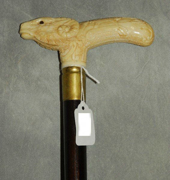 126. Carved bone handle cane 34.75": 126. Carved bone handle cane 34.75"